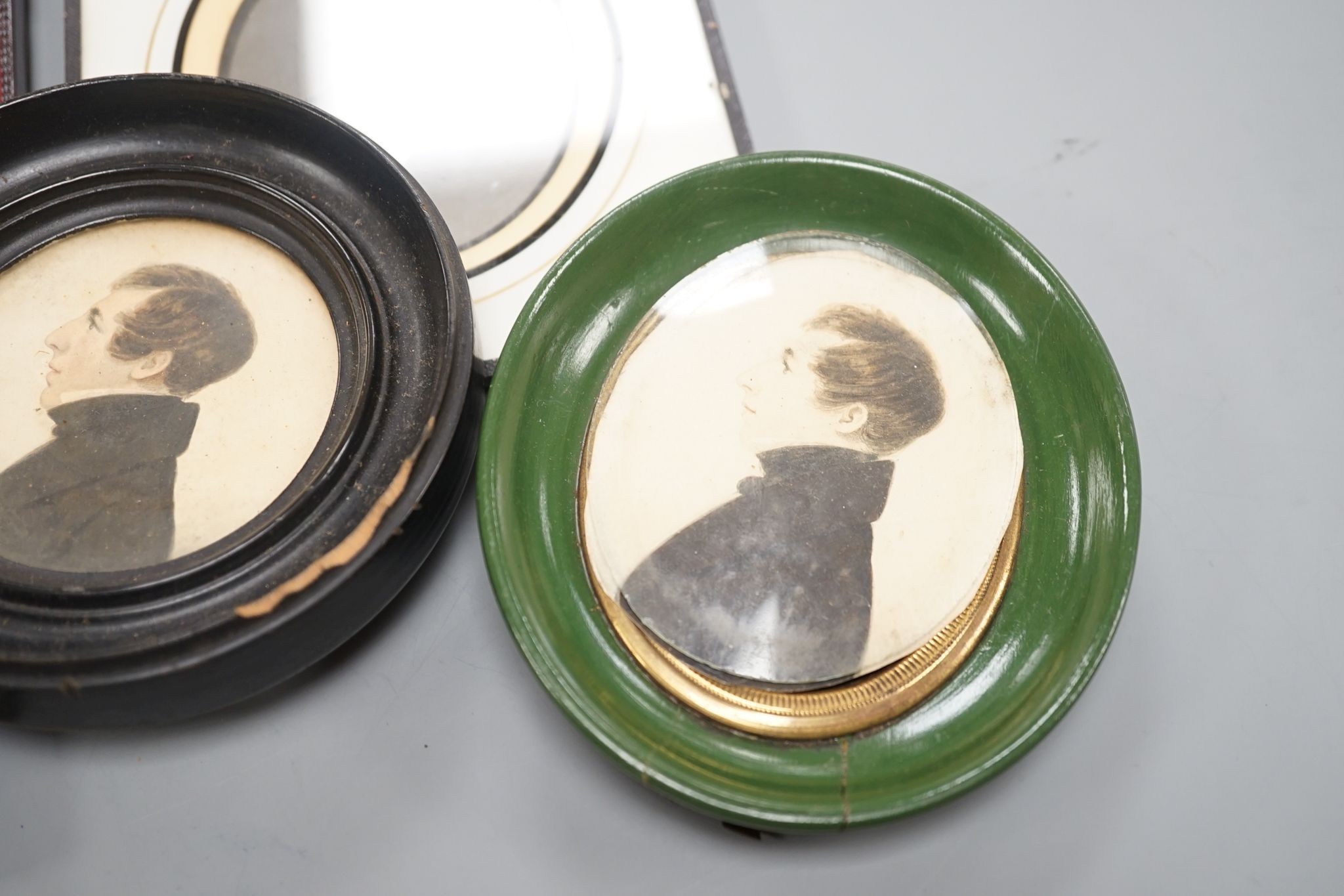 A collection of Victorian photographs etc including a tinted daguerreotype, three portrait miniatures and cabinet cards